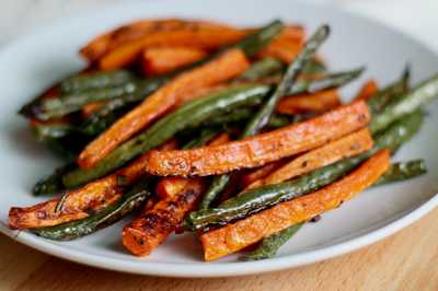 a plate of roasted green beans and carrots