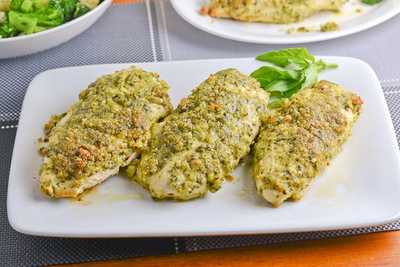 a plate of 3 pesto chicken breasts